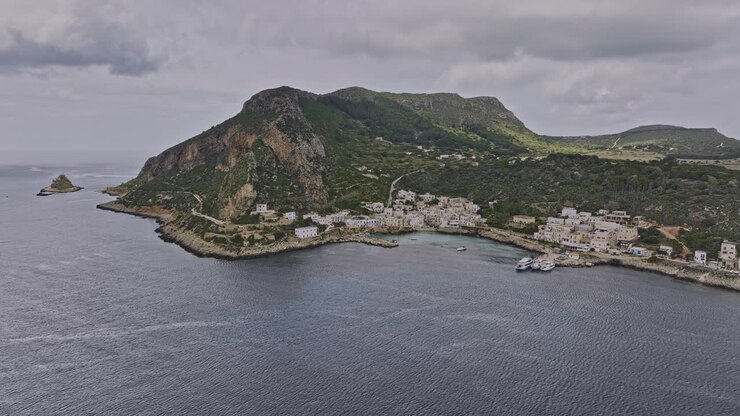 Levanzo Italy Aerial v1 cinematic drone flyover the sea capturing serene coastal landscape of one of the Aegadian Islands in the Mediterranean Sea - Shot with Mavic 3 Cine - May 2023
