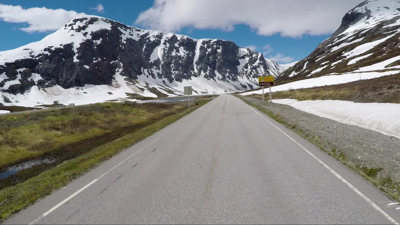 Driving a Car on a Road in Norway