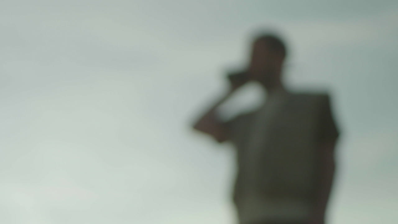 Person Talking on Phone Outdoors