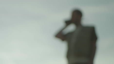 person talking on phone outdoors