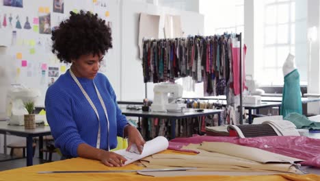 mixed race woman working in creative office