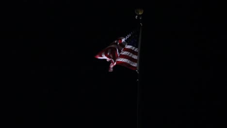 american flag blowing in the wind night shot stars and stripes usa