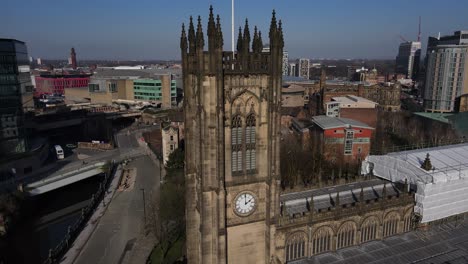 Aerial-drone-flight-around-Manchester-Cathedral-showing-off-its-clocktower-and-stunning-architecture