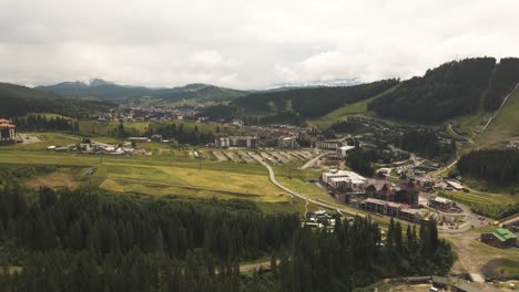 Aerial-shot-of-village-situated-in-beautiful-valley-of-Ukraine