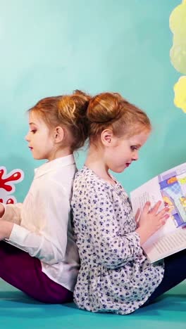 happy kids reading books together after school