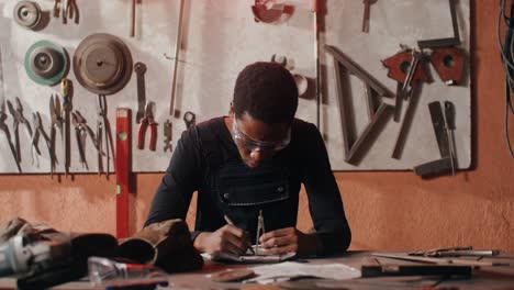 Black Man Working in Workshop