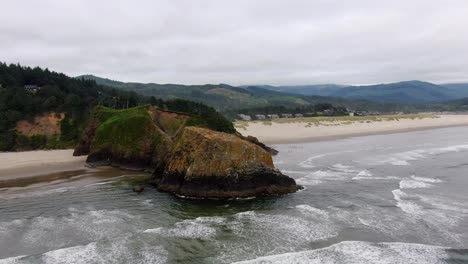 fly above waves in parallel at cloudy beach