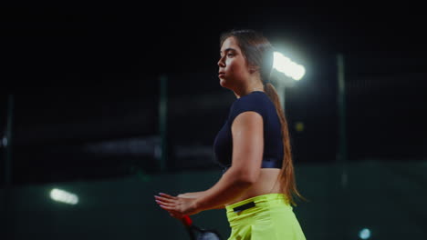 woman tennis player at night