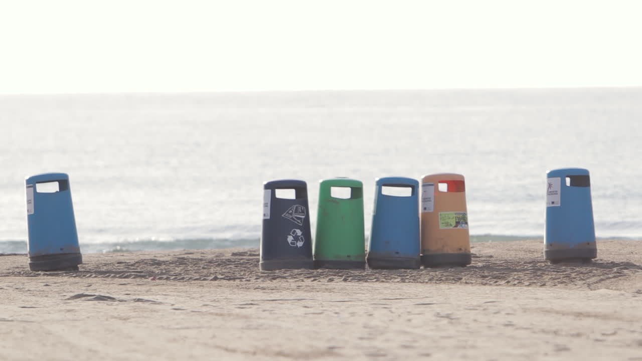 Recycling bins in a beach
