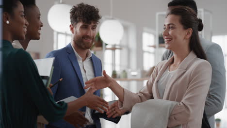 corporate business team meeting clients shaking hands in office welcoming partners to workplace enjoying successful collaboration