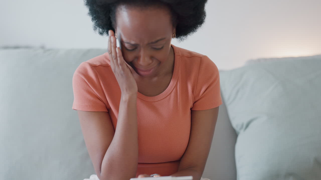 Sad, crying woman with pregnancy test