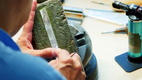 Craftswoman-working-in-workshop