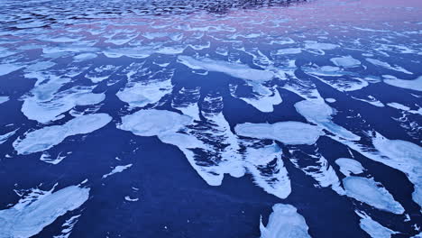 Drone-footage-showcasing-the-expansive-beauty-of-ice-formations-in-the-water