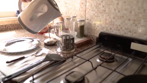 a single man routine preparing breakfast with tea in the kitchen