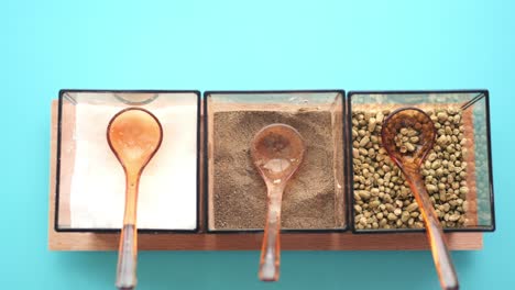 salt, pepper, and spice in a three-compartment container