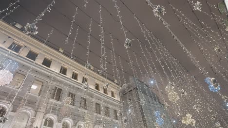 city decorated with christmas lights at night