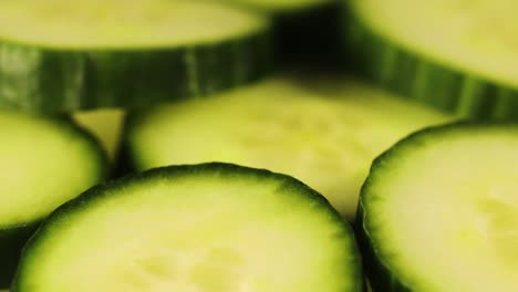 Rotating-shot-of-freshly-cut-cucumber-slices