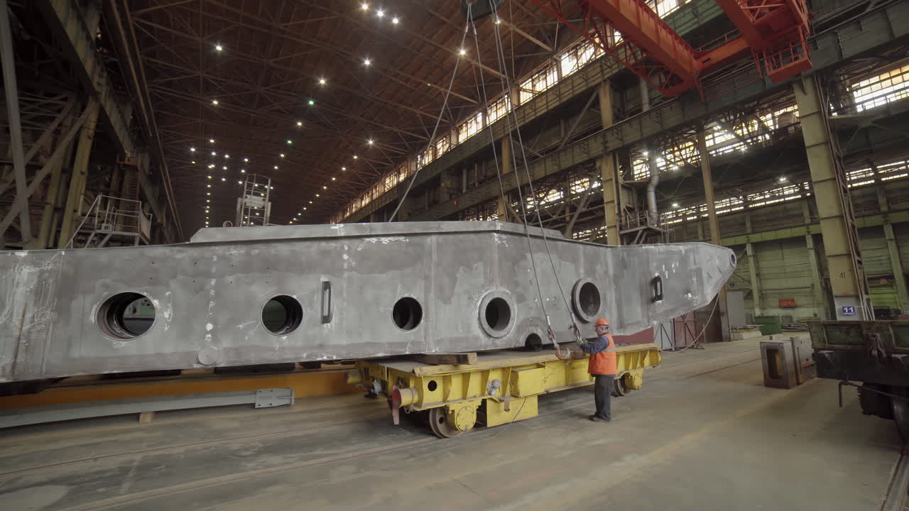 Large Metal Part Being Moved in a Factory