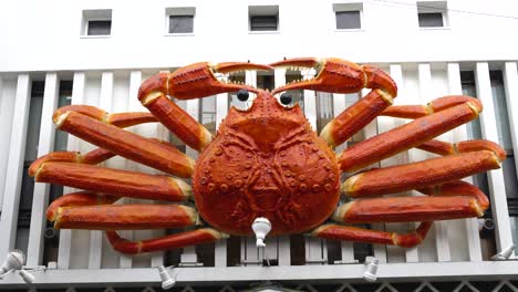 static display of a large crab sign on a building