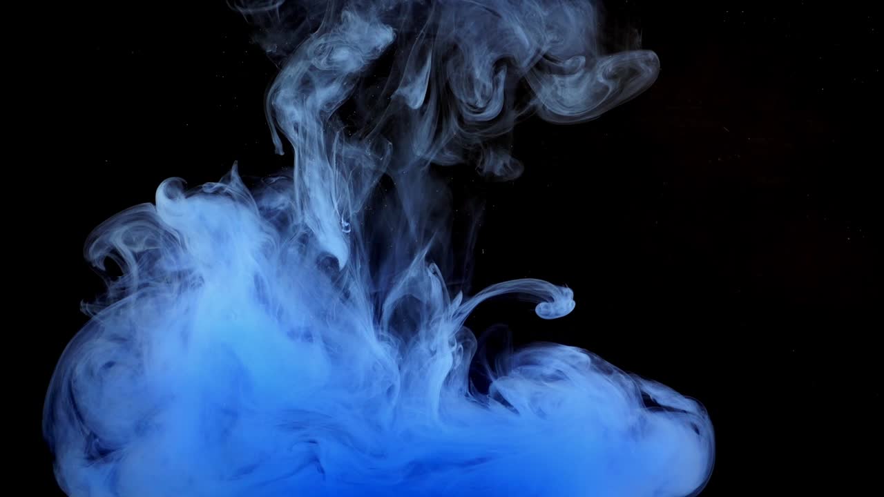 Forme astratte. Riprese su sfondo nero. Mescolanza di colori