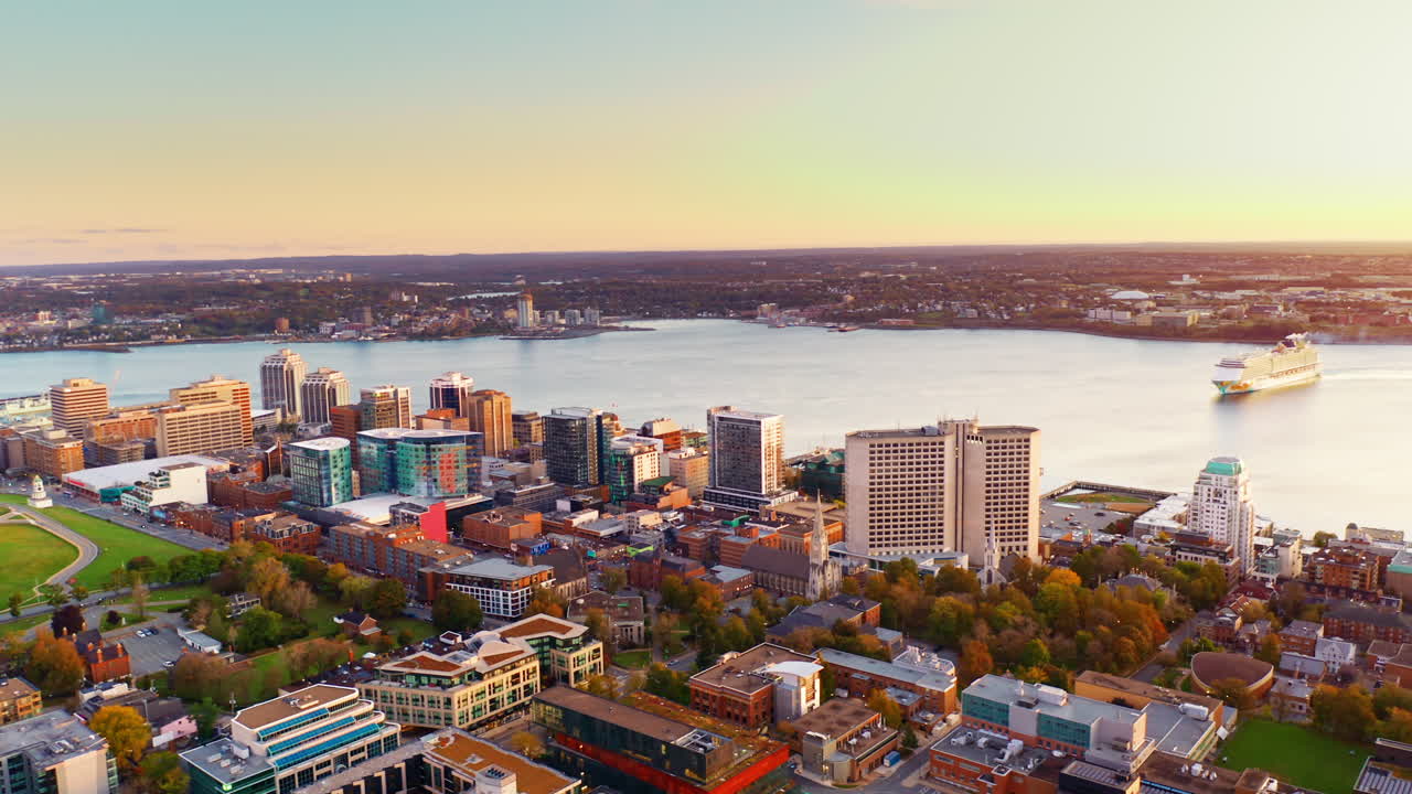 Aerial drone shot over Halifax downtown, Nova Scotia, Canada.
High view of the cityscape, ocean and the urban buildings.
