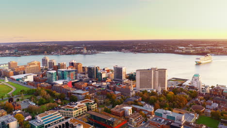 aerial drone shot over halifax downtown, nova scotia, canada.
high view of the cityscape, ocean and the urban buildings.