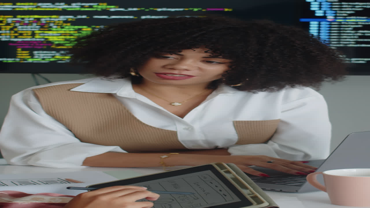 Female Developer Programming Code on Computer