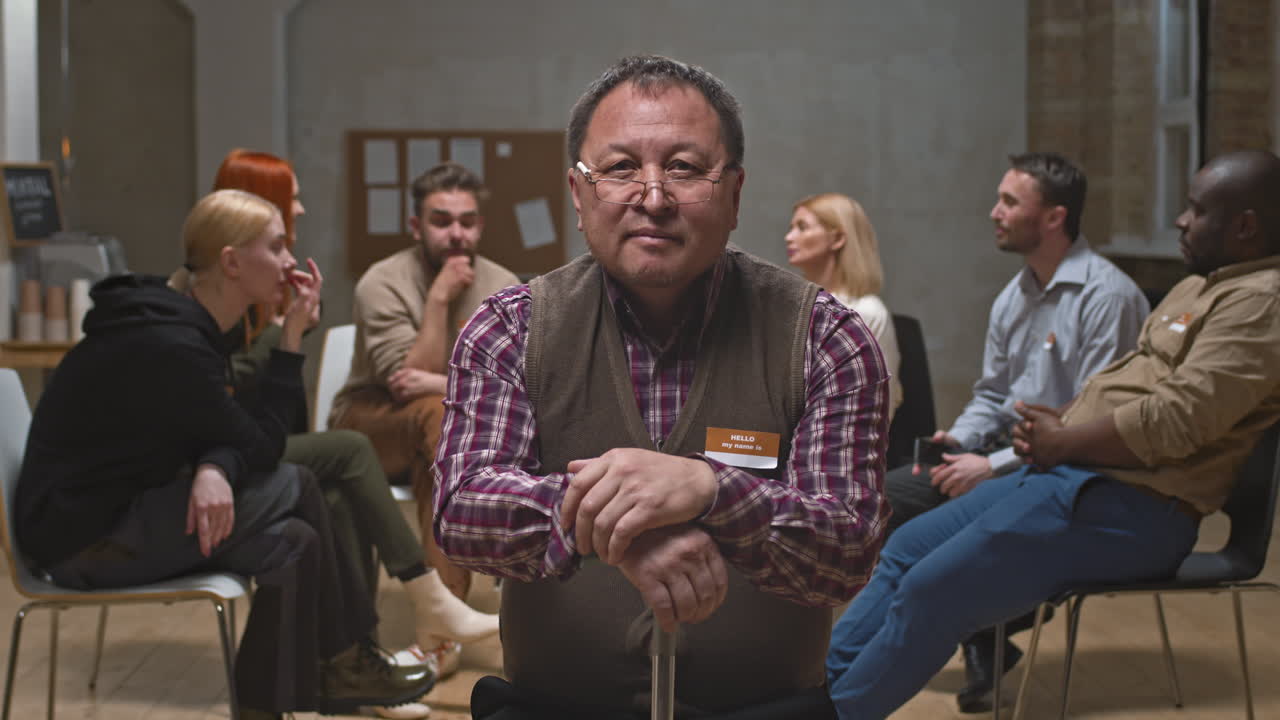 Portrait of Senior Man with Cane at Mental Support Group Meeting