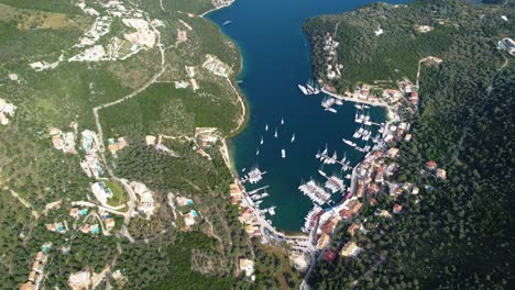 aerial orbital panoramic view over picturesque sivota town bay, greece