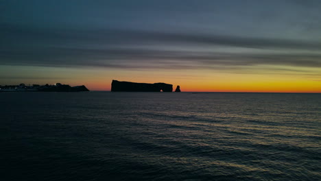 drone view at sunrise of famous perce rock in percé, québec, canada