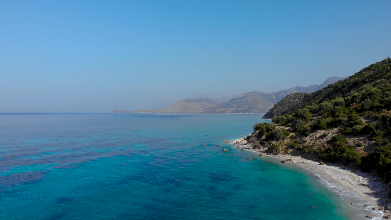 Hidden beaches on beautiful coastline of Mediterranean with azure sea water and mountains background