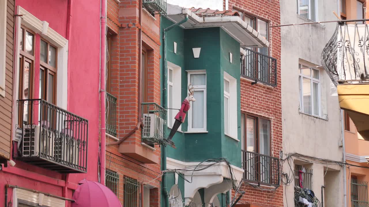 Colorful European Buildings with a Quirky Deer Decoration