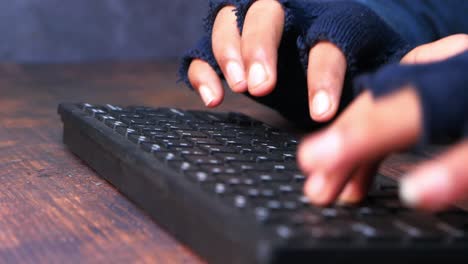 hands typing on a keyboard, possible hacking scene