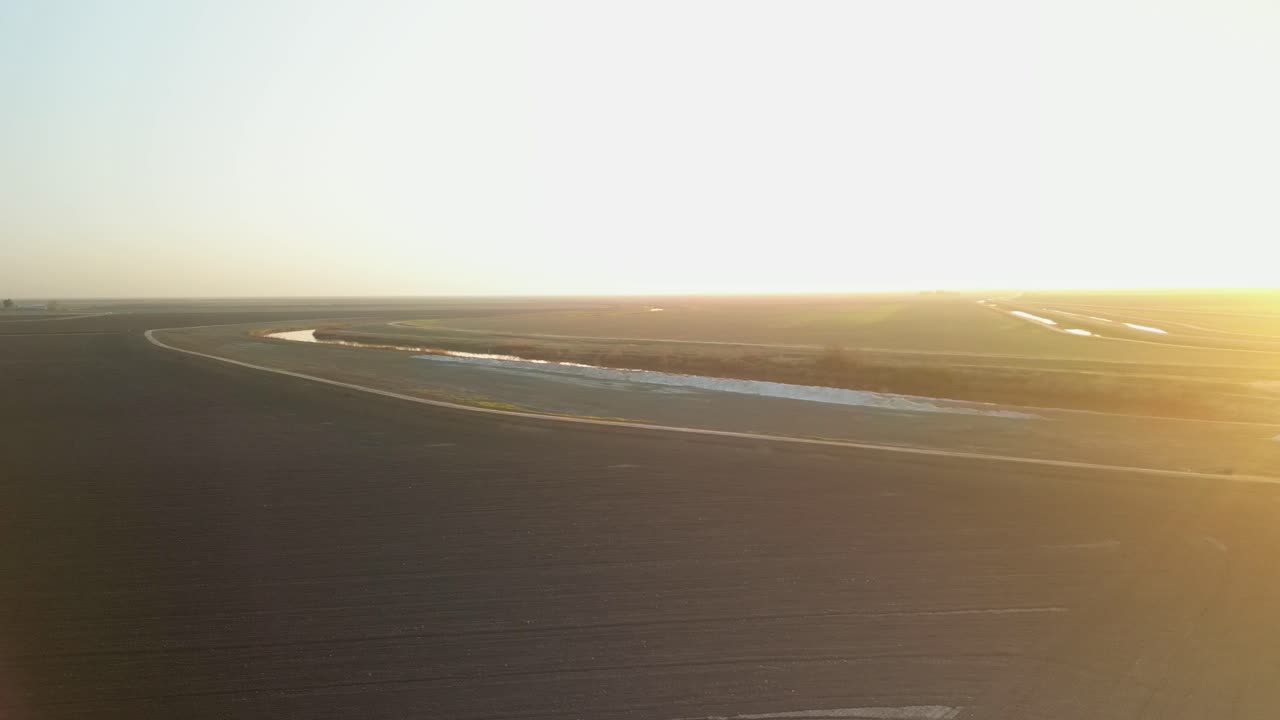 drone footage showcases Lake Tulare’s surroundings, highlighting agricultural fields, irrigation canals, and the rural charm of California’s Central Valley.