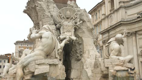 allegories of the fontana dei quattro fiumi in the piazza navona in rome, italy