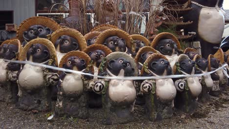 Shigaraki-ceramic-Tanuki-statues-lined-together,-Shiga,-Japan