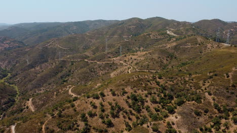 vast mountainscape with electric power station on remote countryside