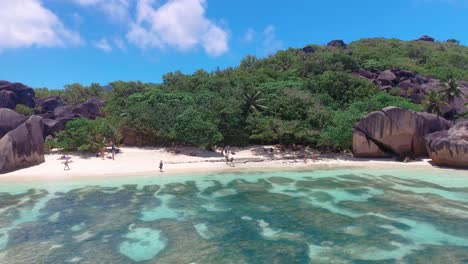 seychelles tropical island luxury vacation, happy tourists on the beach ,luxury vacation ladigue seychelles