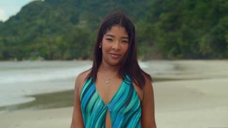 with the turquoise waters of las cuevas beach as her playground, a young girl in a bikini embraces the laid-back charm of trinidad