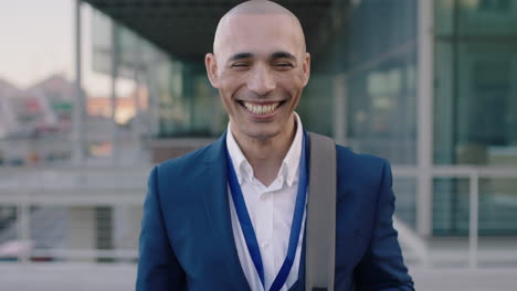 portrait of businessman laughing standing in city successful corporate intern