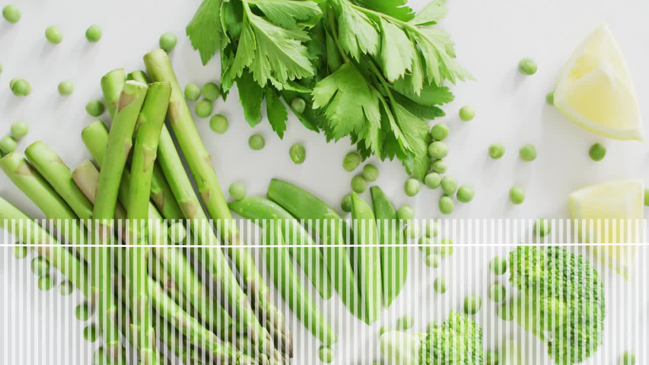 Audio waveform bars oscillating beneath vegetable flat lay, growing spikes matching music rhythm