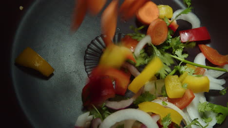 sliced pieces of vegetables fall into the prepared pan