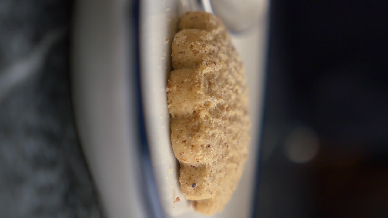 Closeup of a single, baked cookie on a plate