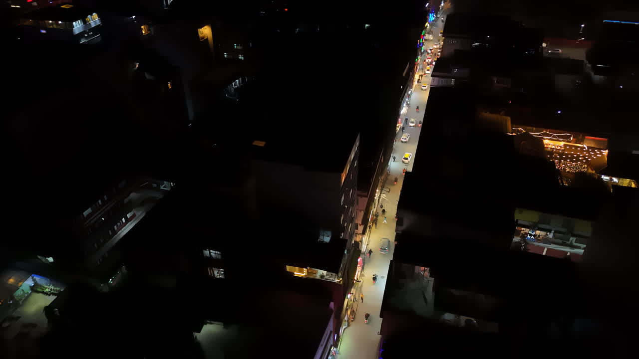 Drone rotating over the illuminated main street, night in Thamel, Kathmandu