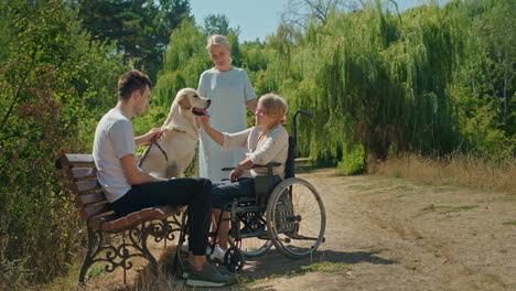 family and friend visit in park with dog