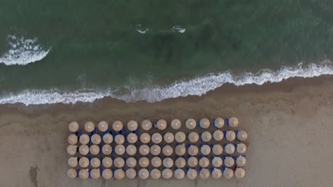 empty sunbeds at the seaside aerial