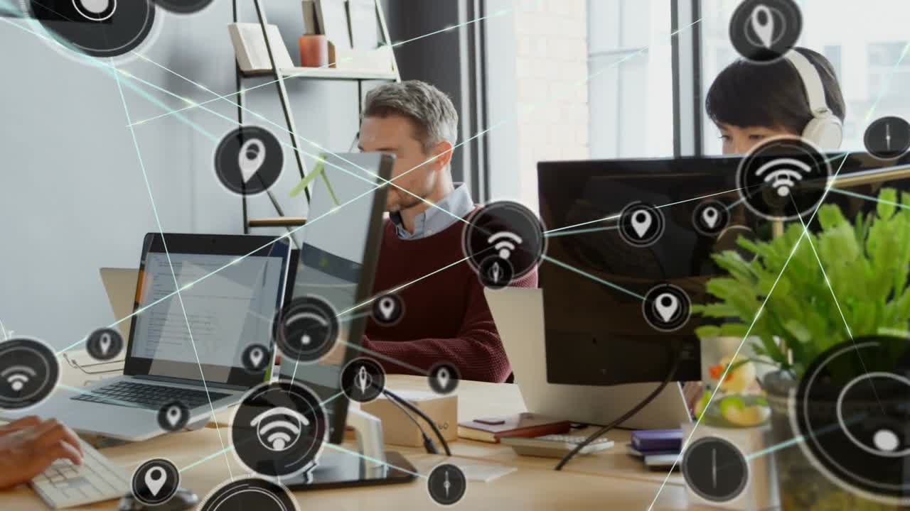 Man looking up while hands typing in office, typing initiating network nodes linking monitors