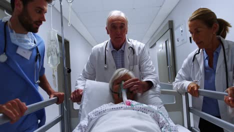 team of doctors taking patient to operation theatre