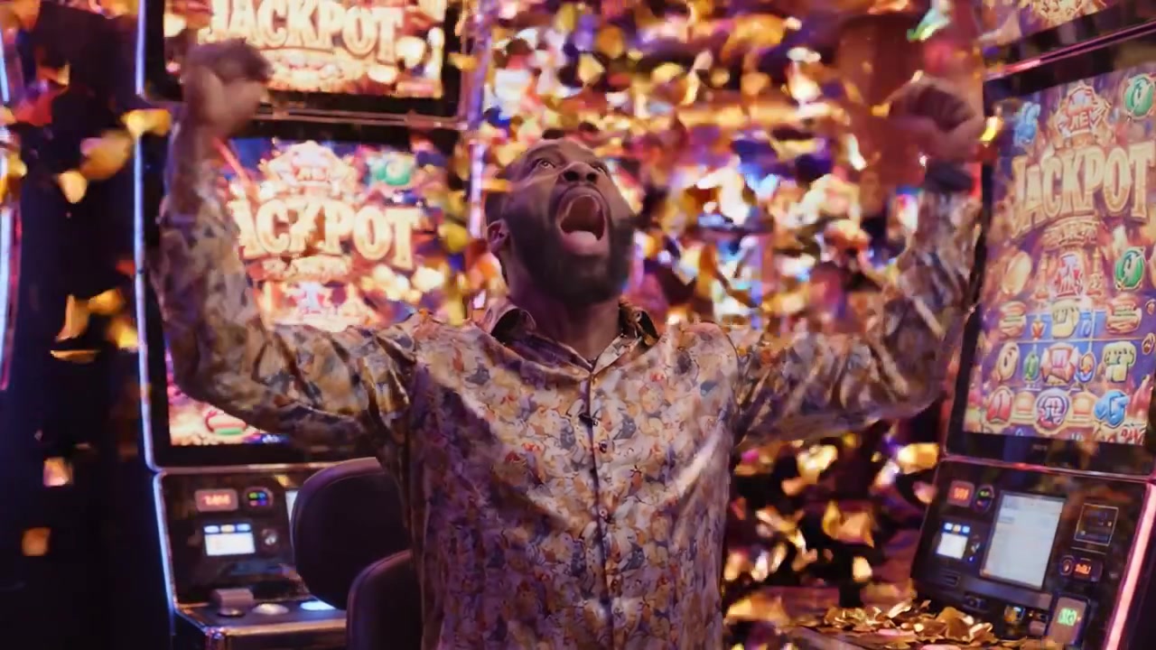 Emozione scatenata: un'esperienza di casinò gioiosa con coriandoli festosi che cadono tra emozionanti slot machine e un'atmosfera vivace