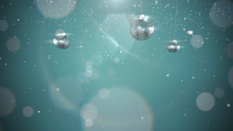 Animated-closeup-motion-silver-balls-and-snowflakes-on-blue-background